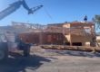 setting trusses on new home with forklift